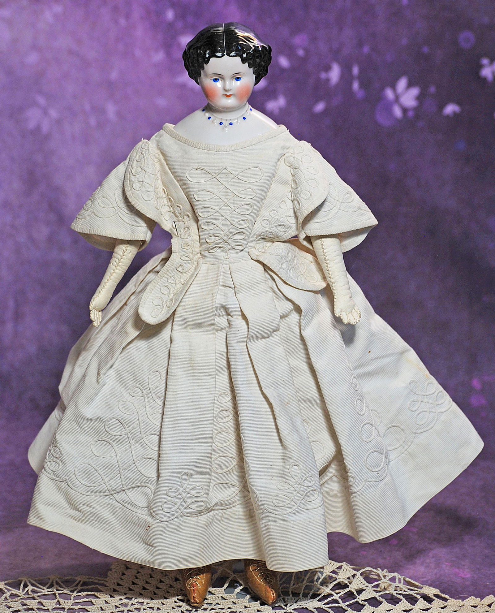 GERMAN PORCELAIN LADY WITH NECKLACE.  15”.  Porcelain shoulderhead with sculpted black hair, (1 of 3)