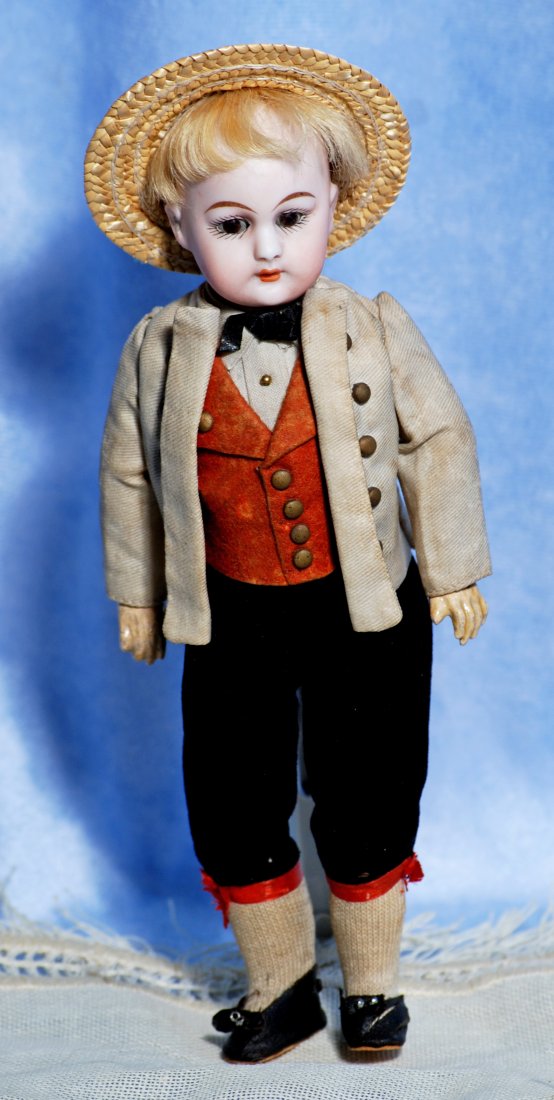 PETITE GERMAN BISQUE DOLL BY SIMON & HALBIG.: PETITE GERMAN BISQUE DOLL BY SIMON & HALBIG. 8 ½” Marks: 1079 Dep S & H Germany. Bisque socket head, brown sleep eyes, painted lashes, tapered brows, open mouth, upper teeth, blonde mohai