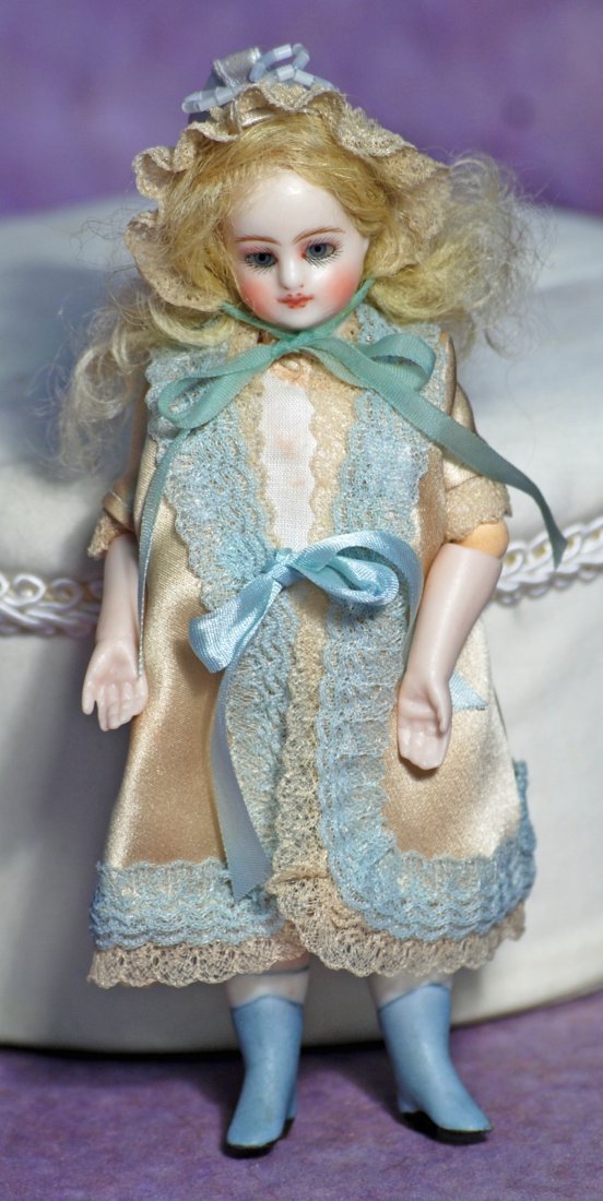 BISQUE MIGNONETTE BY DARLENE LANE.: BISQUE MIGNONETTE BY DARLENE LANE. 5 ½”. Marks: Darlene Lane 2003. All-bisque with swivel head, jointed shoulders, elbows and hips, blue glass eyes, closed mouth, blonde mohair wig, paint