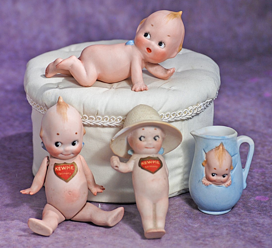 THREE GERMAN BISQUE KEWPIES & KEWPIE PITCHER. (1 of 1)