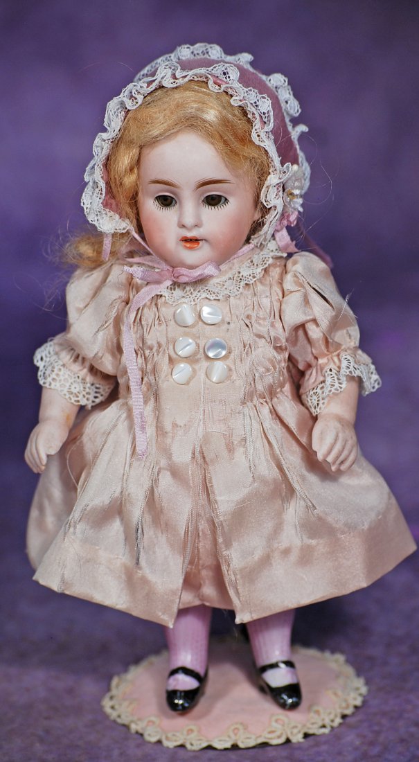 GERMAN ALL-BISQUE DOLL BY KESTNER: GERMAN ALL-BISQUE DOLL BY KESTNER. 7”. Marks: 150. All-bisque, jointed shoulders and hips, brown sleep eyes, painted lashes, feathered b rows, open mouth, upper teeth, blonde mohair wig, painted
