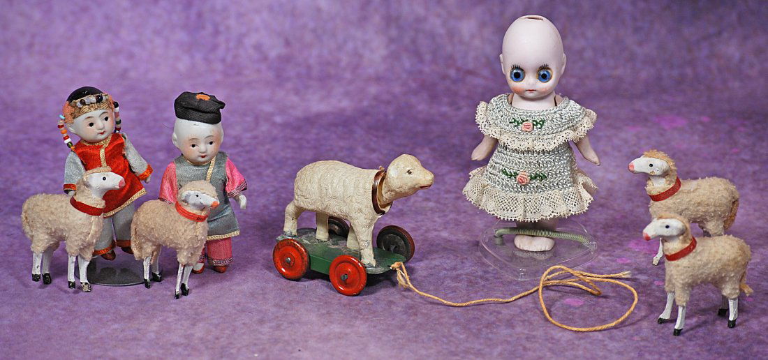 MINIATURE BISQUE DOLLS AND FIVE LAMBS. (1 of 1)
