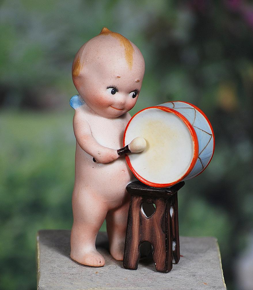 RARE BISQUE KEWPIE WITH PARADE DRUM.  3 ½”.  Marked c in circle.  All-bisque standing (1 of 1)
