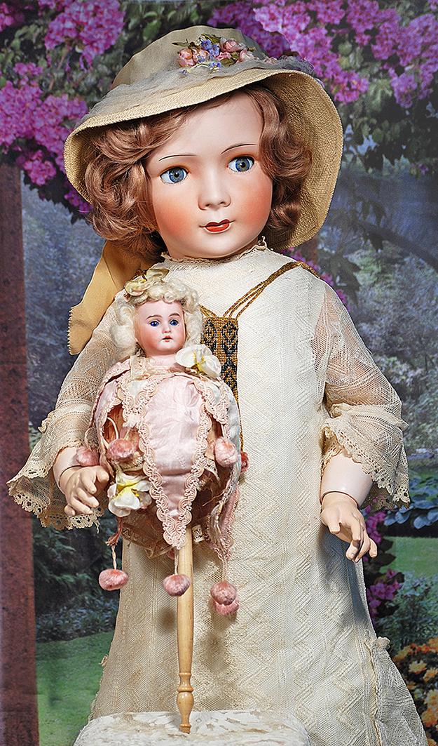 GERMAN BISQUE MAROTTE. 16”. Marks: A.M. 3200. Bisque shoulderhead with stationary blue glass: GERMAN BISQUE MAROTTE. 16”. Marks: A.M. 3200. Bisque shoulderhead with stationary blue glass eyes, painted lashes, feathered brows, open mouth, upper teeth, affixed to musical cylinder with pink