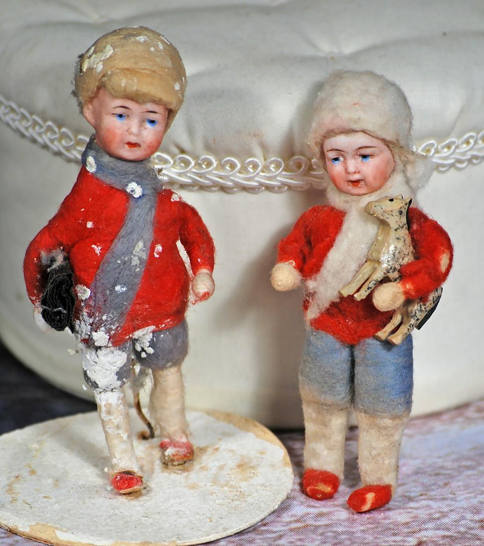 TWO MINIATURE GERMAN BISQUE SNOW KIDS. 4”.  Each is bisque headed child with painted facial (1 of 1)