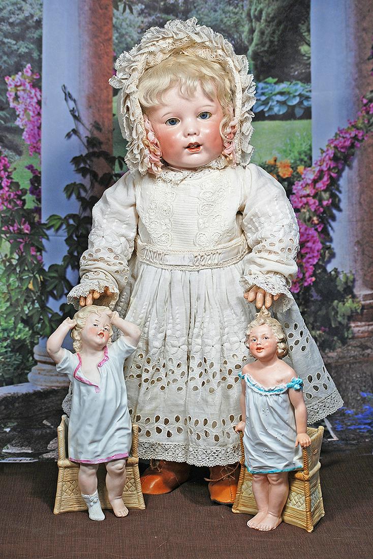 TWO BISQUE FIGURINES BY GEBRUDER HEUBACH.  9 ½”.  Marks: Heubach (sunburst mark). Each is (1 of 2)