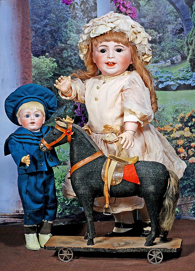 GERMAN PULL TOY HORSE ON WOODEN PLATFORM.  14” x 14”.  Firm-bodied horse with black (1 of 2)