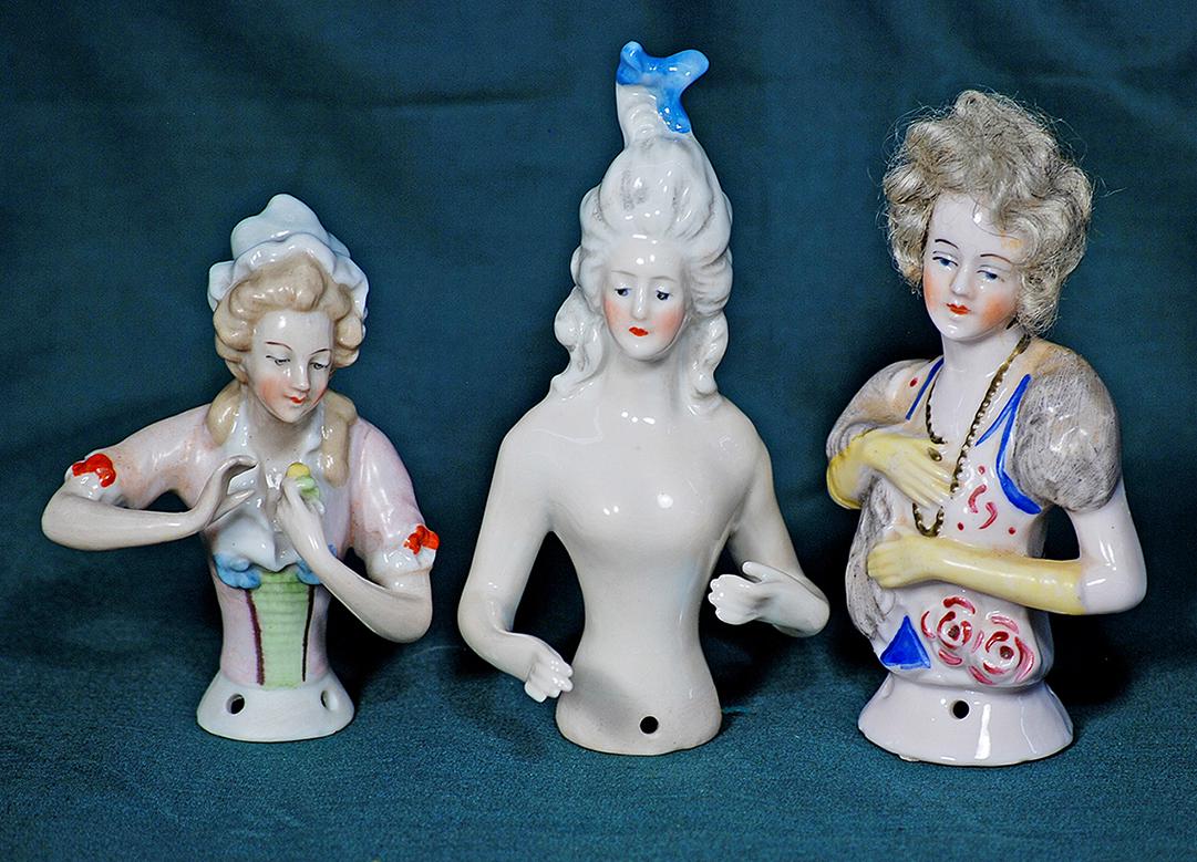 THREE GERMAN PORCELAIN HALF DOLLS. 3 ½” to 4 ¼”.  Each is waist-up figure of (1 of 1)