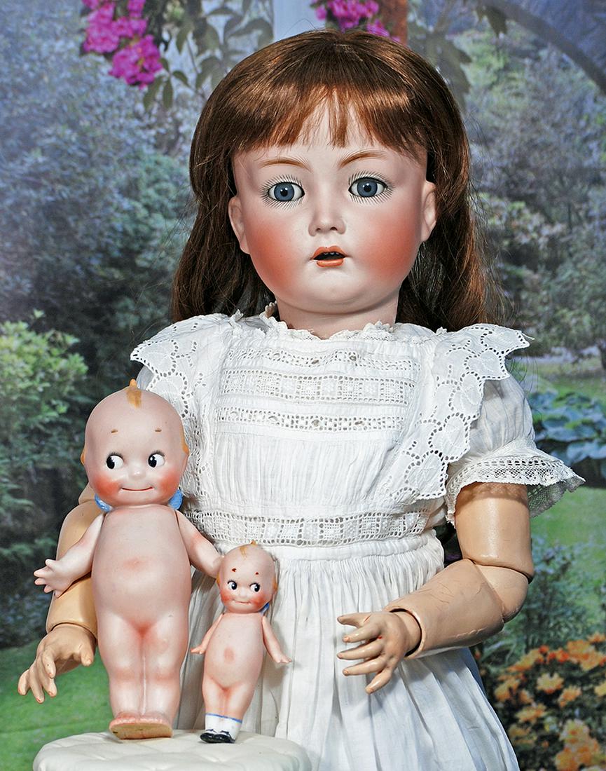 TWO GERMAN BISQUE KEWPIES.  Each is all-bisque with painted classic Kewpie features, topknot and (1 of 2)