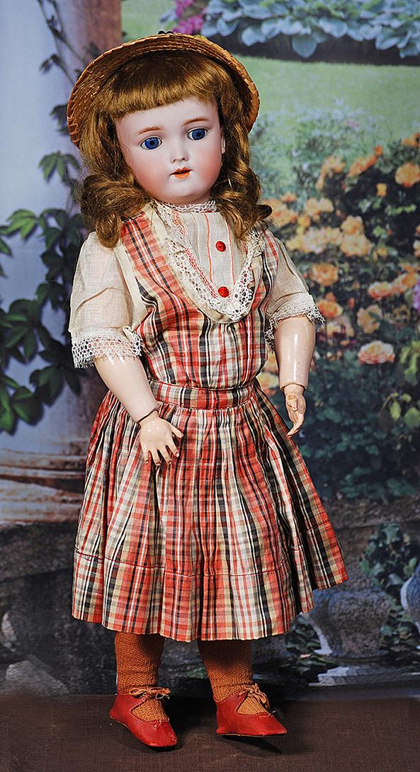 GERMAN BISQUE CHILD BY KAMMER AND REINHARDT. 18”. Marks: Germany, Heinrich Handwerck, Simon: GERMAN BISQUE CHILD BY KAMMER AND REINHARDT. 18”. Marks: Germany, Heinrich Handwerck, Simon and Halbig. Bisque socket head, blue sleep eyes, painted lashes, feathered brows, pierced ears, open m