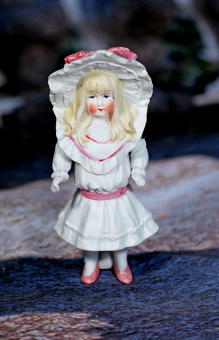 PETITE GERMAN ALL-BISQUE GIRL.  4 ¾”.  All-bisque girl jointed at shoulders, sculpted (1 of 1)