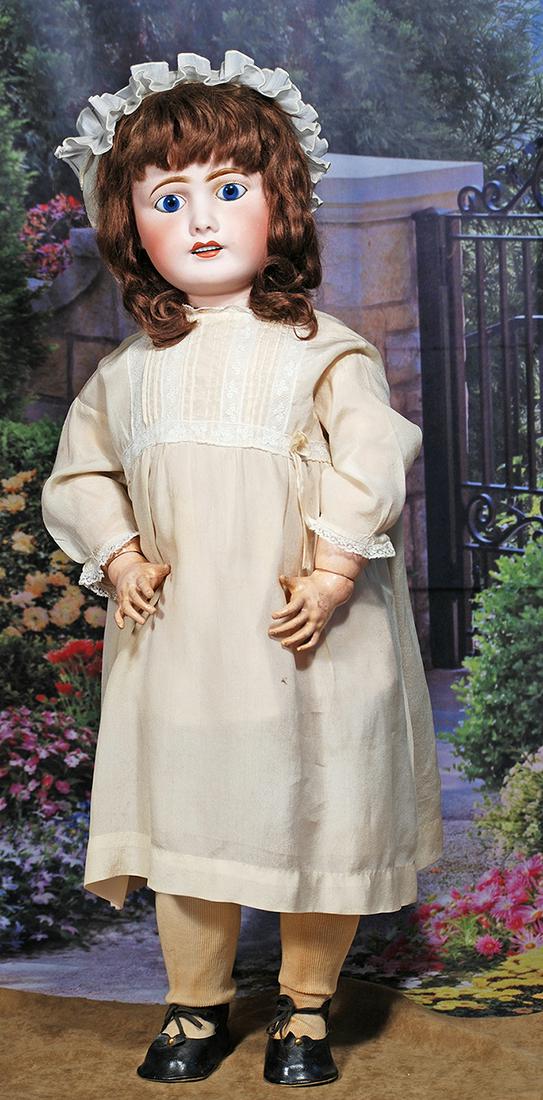 FRENCH BISQUE BEBE BY LIMOGES. 26”. Marks: Limoges France 12. Bisque socket head, brilliant: FRENCH BISQUE BEBE BY LIMOGES. 26”. Marks: Limoges France 12. Bisque socket head, brilliant blue inset glass eyes, painted lashes, feathered brows, pierced ears, open mouth, accented lips, upper