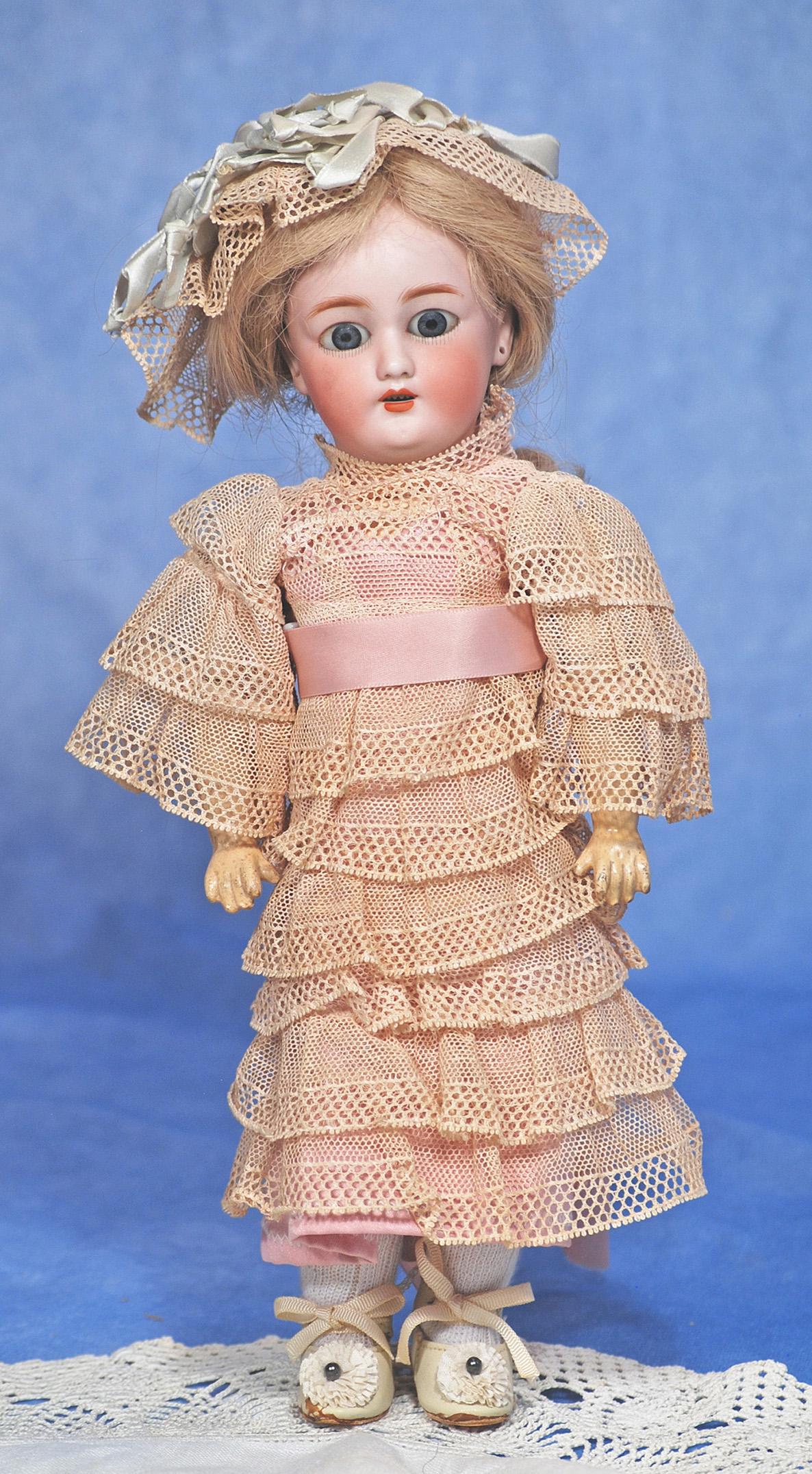 GERMAN BISQEU DOLL 1159 BY SIMON & HALBIG. 12”. Marks: 1159 Halbig S & H 4. Bisque socket: GERMAN BISQEU DOLL 1159 BY SIMON & HALBIG. 12”. Marks: 1159 Halbig S & H 4. Bisque socket head, stationary blue glass eyes, painted lower lashes, feathered brows, pierced ears, open mouth, upper