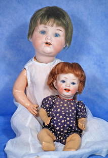 TWO BISQUE CHARACTER BABIES. 7 ½” doll marked Nippon; 12” doll marked A M 990.: TWO BISQUE CHARACTER BABIES. 7 ½” doll marked Nippon; 12” doll marked A M 990. Each has bisque socket head, Nippon baby has stationary eyes, open mouth, mohair wig, composition baby b