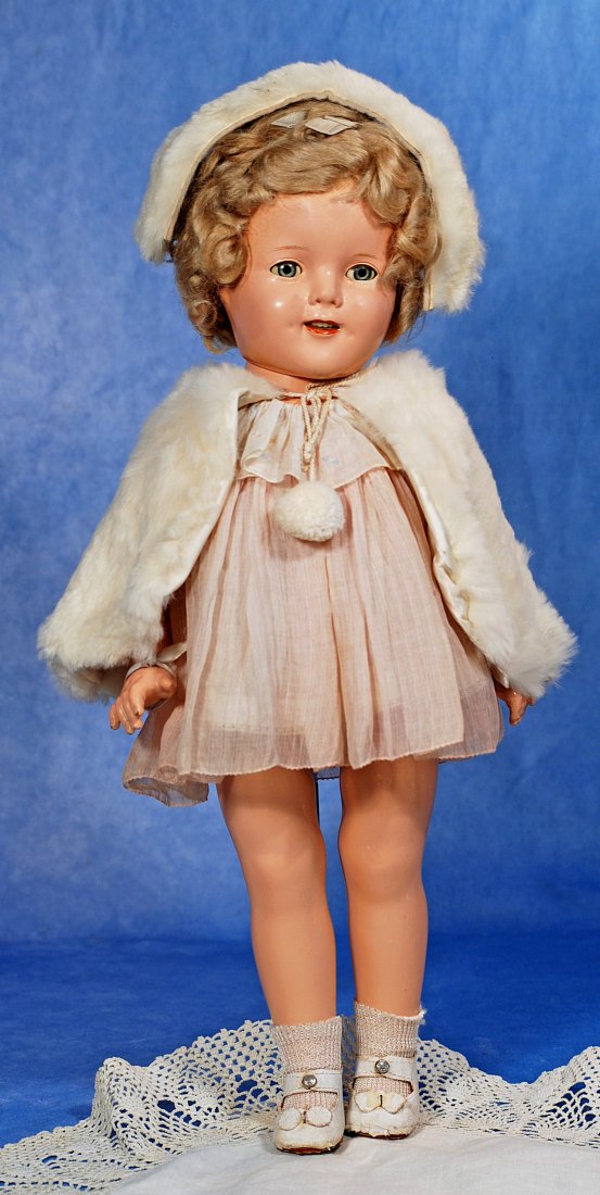COMPOSITION SHIRLEY TEMPLE: 281. COMPOSITION SHIRLEY TEMPLE. 18”. Marks: 18 Copr. Ideal N & T Co. Composition socket head on five â€“piece jointed body, sleep eyes, applied and painted lashes, open mouth, upper teeth,