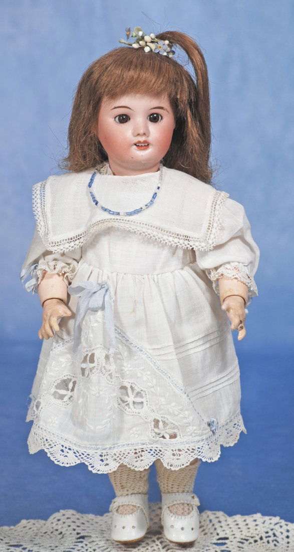FRENCH BISQUE BLUETTE BY S.F.B.J.: 286. FRENCH BISQUE BLUETTE BY S.F.B.J. 11”. Marks: SFBJ 60 Paris. Bisque socket head, brown sleep eyes, painted lower lashes, tapered brows, open mouth, upper teeth, human hair wig, French compo