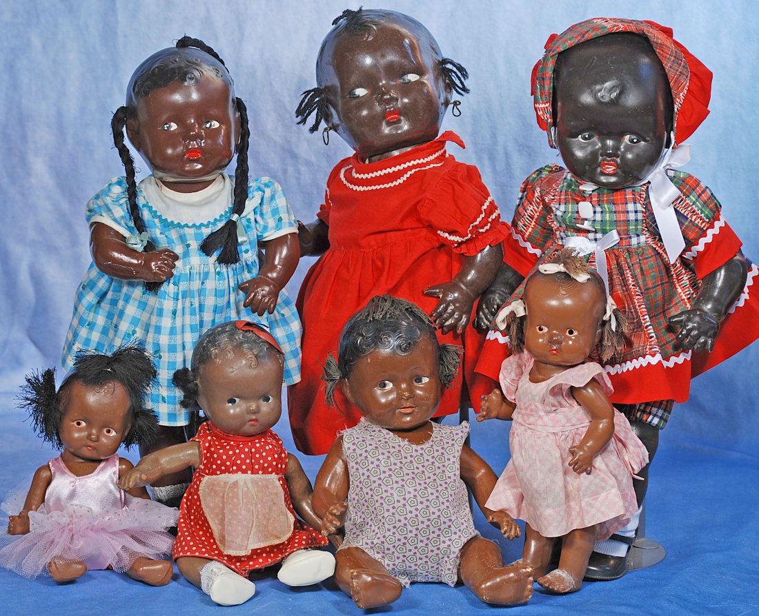 COLLECTION OF SEVEN BLACK AND BROWN COMPLEXIONED COMPOSITION DOLLS (1 of 1)