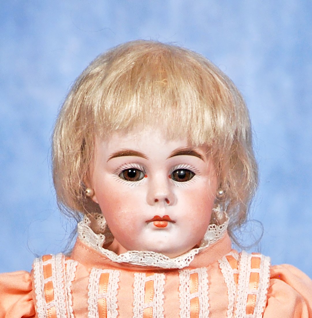 PETITE GERMAN BISQUE CLOSED MOUTH DOLL. (1 of 2)