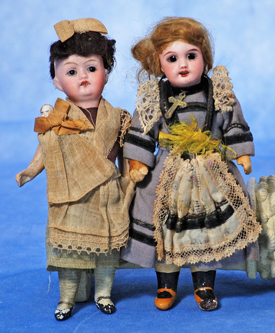 PAIR OF TINY GERMAN BISQUE DOLLS. (1 of 1)