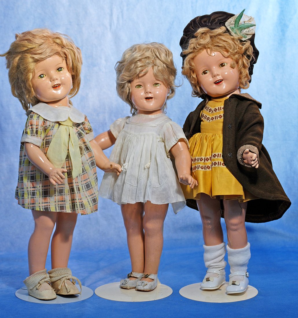 THREE COMPOSITION SHIRLEY TEMPLE DOLLS BY IDEAL: THREE COMPOSITION SHIRLEY TEMPLE DOLLS BY IDEAL. One 18” and two 20” dolls. Each has composition socket head on five-piece jointed body, sleep eyes, open mouth, upper teeth, original blond