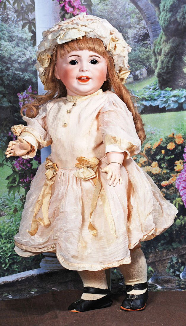 S,F,B,J. LAUGHING JUMEAU TODDLER BY S.F..BJ.: FRENCH BISQUE CHARACTER, 236, WITH TODDLER BODY BY S.F.B.J. 24”. Marks: SFBJ 236 Paris 11. Bisque socket head, brown sleep eyes, painted lashes, eyeliner, feathered and brushstroked brows, open/