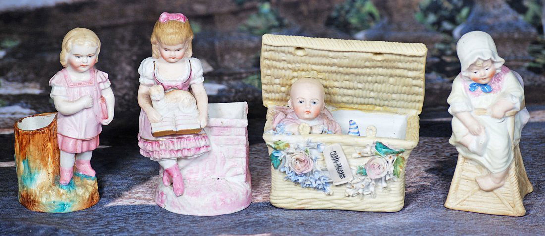 FOUR GERMAN BISQUE NOVELTY FIGURES. (1 of 1)