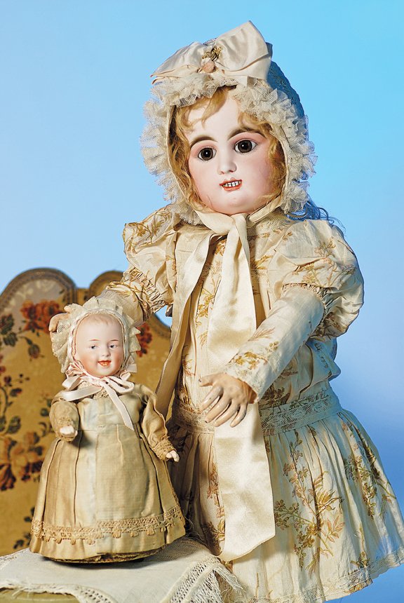GERMAN BISQUE MECHANICAL WALKING DOLL BY GEBRUDER: GERMAN BISQUE MECHANICAL WALKING DOLL BY GEBRUDER HEUBACH. Marks: Heubach sunburst mark/ 7604 Germany. 9”. Solid dome bisque socket head with sculpted blonde hair, painted features, intaglio blue ey
