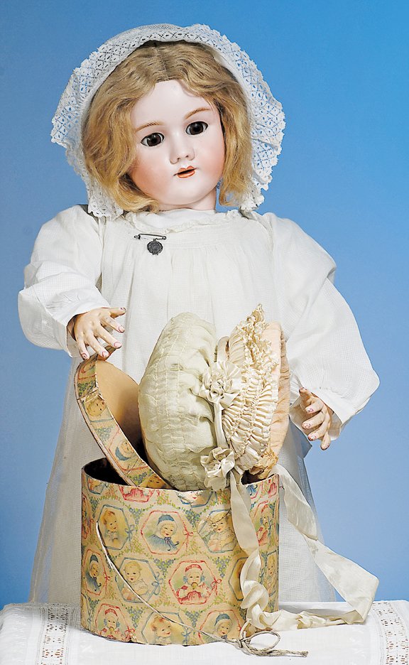 ANTIQUE CHILD'S BONNET IN ORIGINAL BOX. 5 ½” wide: ANTIQUE CHILD'S BONNET IN ORIGINAL BOX. 5 ½” wide inside cap. Pale aqua and ivory silk bonnet is shirred from center back to front, brim of three tightly-pleated rows of ivory silk with silk rosett