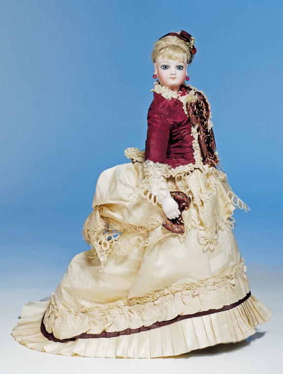 ESPECIALLY BEAUTIFUL JUMEAU POUPEE WITH “WRAP-ARO: ESPECIALLY BEAUTIFUL JUMEAU POUPEE WITH “WRAP-AROUND” EYES & ORIGINAL SHOP LABEL. Marks: 6 (head); Au Calife de Bagdad, 14 Rue de Choise (shop label on chest). 17”. Bisque swivel head on bisque 
