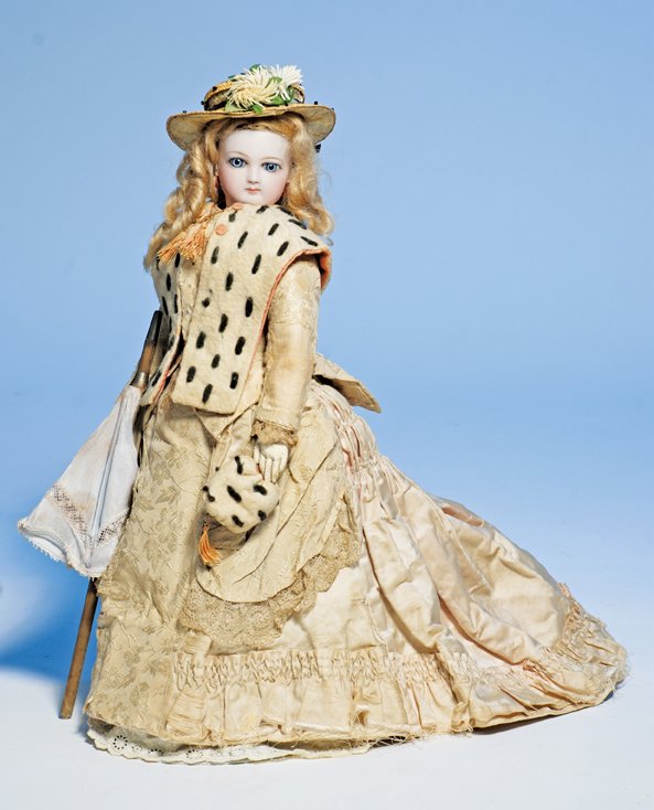 VERY LOVELY JUMEAU BISQUE POUPEE IN ORIGINAL FITT: VERY LOVELY JUMEAU BISQUE POUPEE IN ORIGINAL FITTED GOWN. Marks: 2. 15”. Bisque swivel head on bisque shoulderplate, almond-shaped blue paperweight eyes, dark eyeliner, painted lashes, feathered and