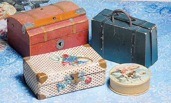 MINIATURE TRUNKS & LUGGAGE FOR SMALL DOLLS. Inclu: MINIATURE TRUNKS & LUGGAGE FOR SMALL DOLLS. Includes: 4” W. dome-top trunk with paper covering, wooden band and metal accents, striped paper interior, lift-out tray; 4” W. firmly-shaped cardboard