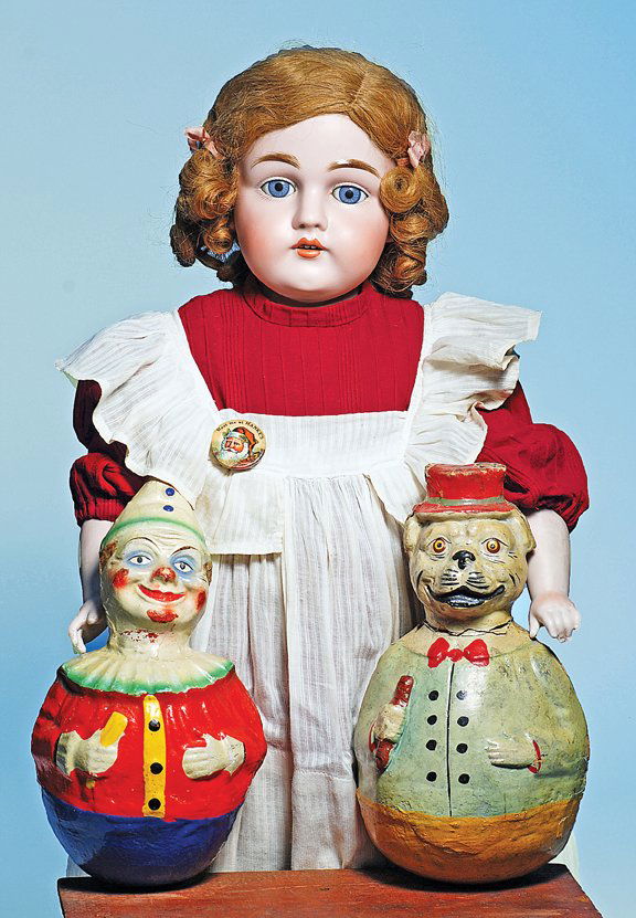 PAPIER MACHE ROLLY-DOLLY CLOWN & POLICEMAN. 9 ½”.: PAPIER MACHE ROLLY-DOLLY CLOWN & POLICEMAN. 9 ½”. Each is molded papier mache with sculpted hat and distinctly characterized features, weighted-base ball-shaped body with colorful painted clothing,