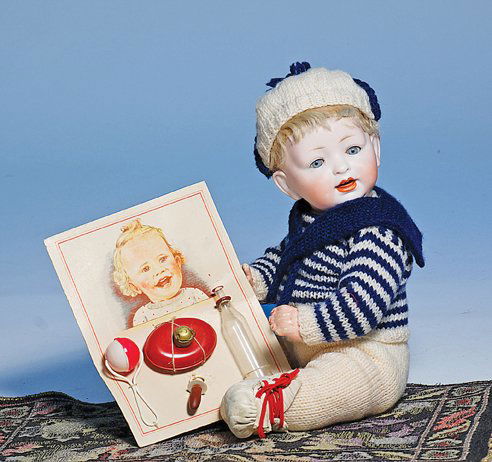 DOLL’S NURSING SET ON ORIGINAL PRESENTATION CARD.: DOLL’S NURSING SET ON ORIGINAL PRESENTATION CARD. 6 ½” x 5”. Illustrated card holds glass nursing bottle, pacifier, hot water bottle and rattle. Commentary: All-original, very good condition.