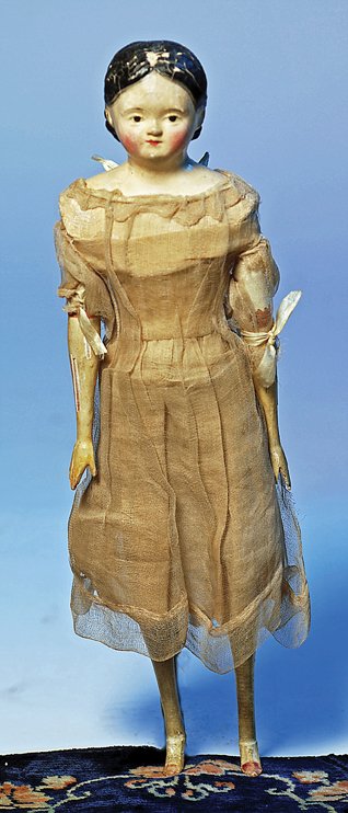 GERMAN PAPIER MACHE MILLINER’S MODEL. 12”. Papier: GERMAN PAPIER MACHE MILLINER’S MODEL. 12”. Papier mache shoulderhead with rounded youthful face, molded black hair waved behind modeled ears, painted brown eyes, tapered brows, closed mouth in sli