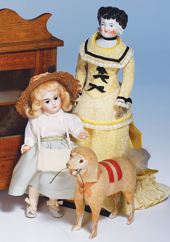 FRENCH PAPIER MACHE DOG WITH STICK. 6”. Molded pa: FRENCH PAPIER MACHE DOG WITH STICK. 6”. Molded papier mache with painted face, open mouth with stick, amber glass eyes, nubby ivory flannel covering with bushy tail, painted wooden legs, red blanket
