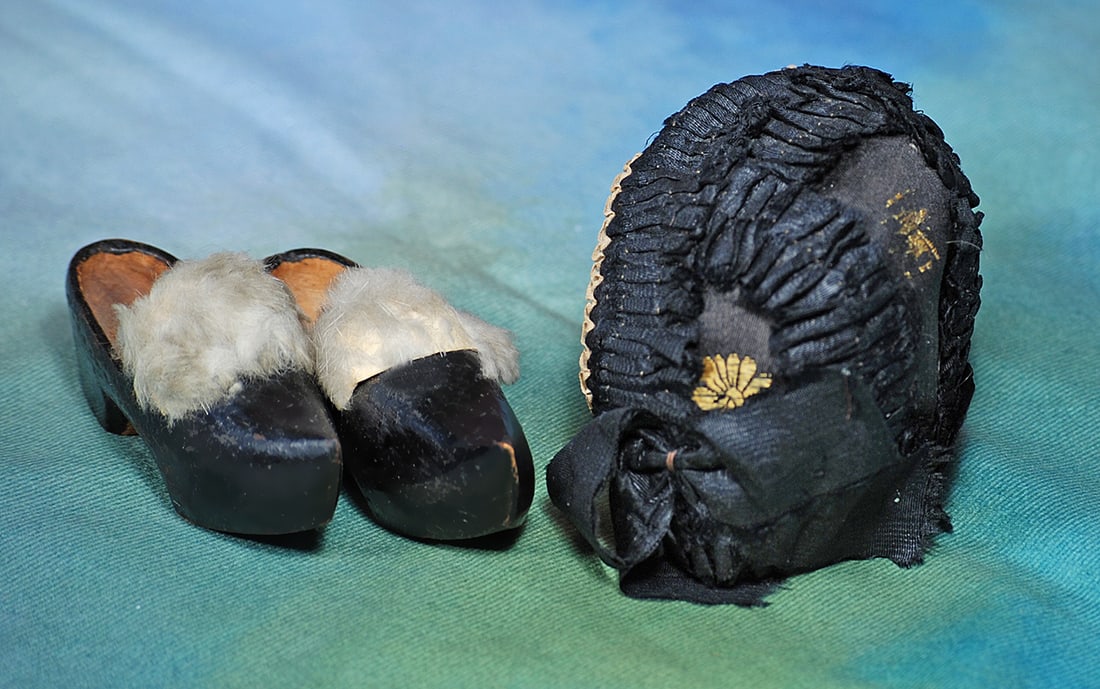 ANTIQUE SILK DOLL BONNET AND PAIR OF WOODEN CLOGS.  Black silk bonnet with extensive black silk (1 of 1)