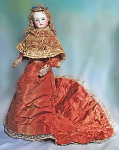 FRENCH BISQUE POUPEE BY JUMEAU IN ORIGINAL SILK GOWN. 17”. Marks: None visible. Bisque: FRENCH BISQUE POUPEE BY JUMEAU IN ORIGINAL SILK GOWN. 17”. Marks: None visible. Bisque swivel head on bisque shoulderplate, light blue paperweight eye, painted lashes, feathered brows, pierced e