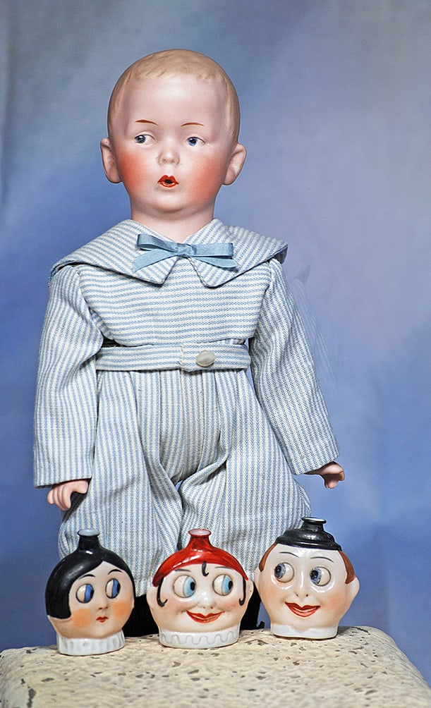 THREE GERMAN PORCELAIN GOOGLY-EYED PERFUME FLASKS BY HERTWIG.: THREE GERMAN PORCELAIN GOOGLY-EYED PERFUME FLASKS BY HERTWIG. 1 ¾”. Each has sculpted face with flat back, large round and side-glancing blue googly eyes, painted hair, and white neck ruf