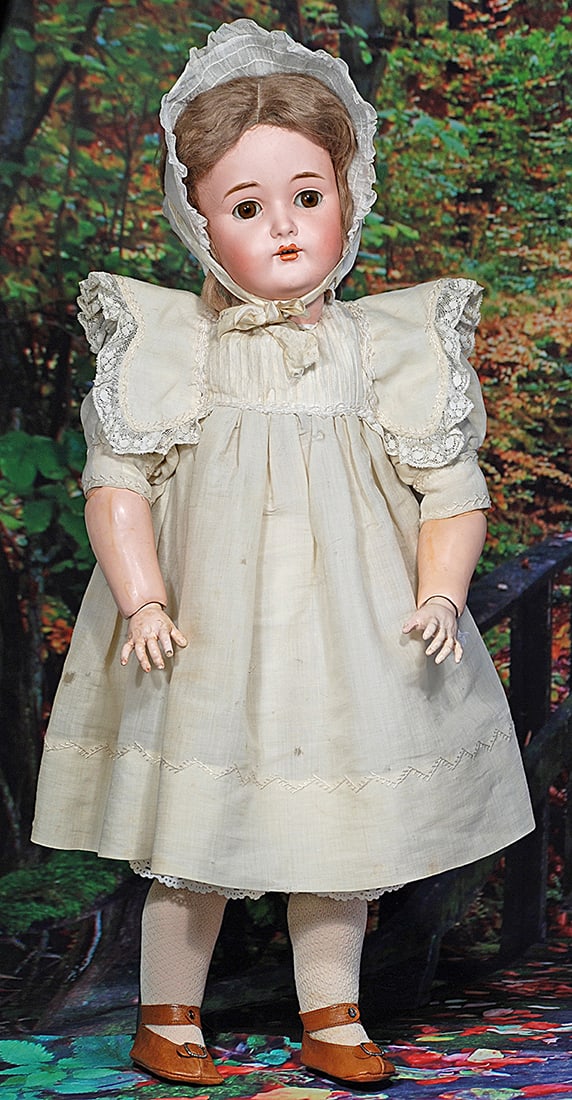 GERMAN BISQUE CHILD BY KAMMER AND REINHARDT. 27”. Marks: K * R/ 14. Bisque socket head,: GERMAN BISQUE CHILD BY KAMMER AND REINHARDT. 27”. Marks: K * R/ 14. Bisque socket head, brown sleep eyes, painted and applied lashes, feathered brows, open mouth, shaded and accented lips, upper