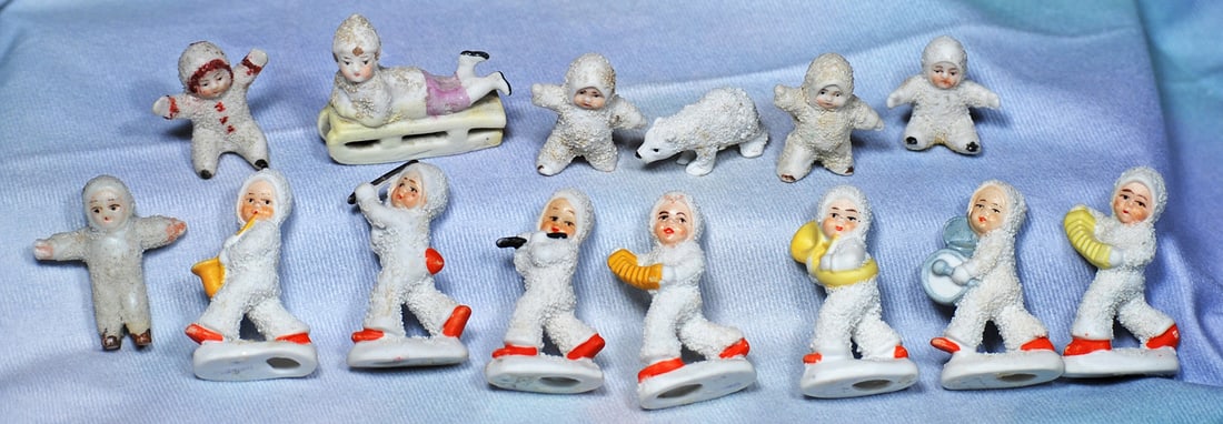 FOURTEEN MINIATURE BISQUE SNOW BABY FIGURES. 1” to 2”.  Each is all-bisque one-piece (1 of 1)
