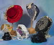 COLLECTION OF ASSORTED DOLL HATS. Vintage and contemporary doll bonnets in various styles and