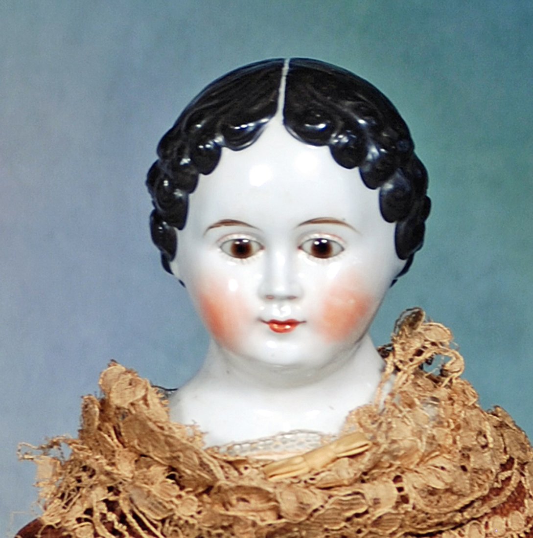 RARE GERMAN CHINA LADY WITH BROWN GLASS EYES. (1 of 2)