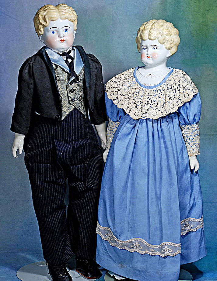 TWO BLONDE-HAIRED CHINA DOLLS. 24”.  Each has porcelain shoulderhead with sculpted blonde (1 of 1)