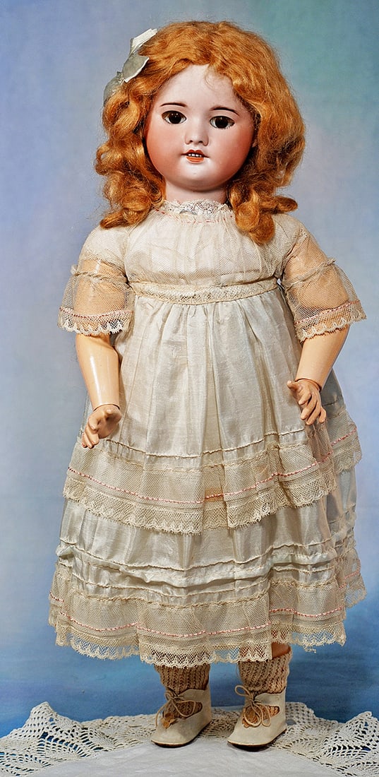 FRENCH BISQUE BEBE BY S.F.B.J. 22”. Marks: SFBJ 60 Paris. Bisque socket head, brown glass: FRENCH BISQUE BEBE BY S.F.B.J. 22”. Marks: SFBJ 60 Paris. Bisque socket head, brown glass sleep eyes, applied upper lashes, painted lower lashes, feathered brows, open mouth, upper teeth, auburn