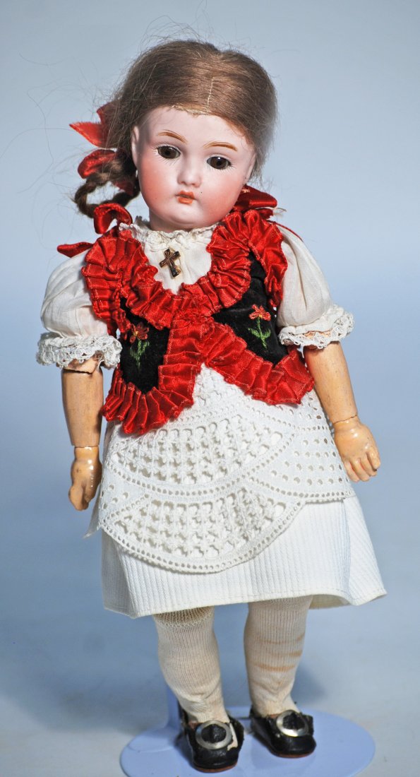 GERMAN BISQUE DOLL BY KESTNER: 41. GERMAN BISQUE DOLL BY KESTNER. 10”. Marks: 174 made in Germany. Bisque socket head, brown sleep eyes, painted lashes, feathered brows, open mouth, upper teeth, brown mohair wig, fully-jointe