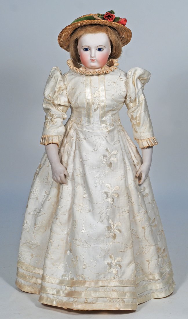 FRENCH BISQUE, GLASS-EYED POUPEE IN THE ROHMER MANNER.: 49. FRENCH BISQUE, GLASS-EYED POUPEE IN THE ROHMER MANNER. 17”. Marks: None. Bisque shoulderhead, inset cobalt blue glass eyes, eyeliner, painted lashes, closed mouth, accented lips, unpierced e