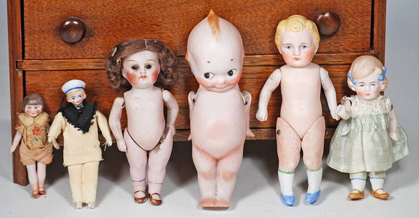 ASSORTED ALL-BISQUE AND DOLL HOUSE DOLLS: 65. ASSORTED ALL-BISQUE AND DOLL HOUSE DOLLS. Four all-bisque dolls 4” to 5 ½”. Includes: Standing Kewpie, doll jointed shoulders and hips, painted hair and features, doll jointed s