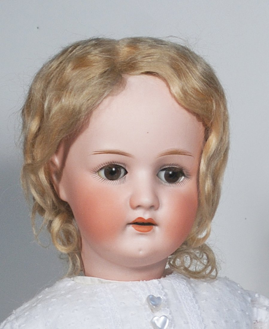 GERMAN BISQUE CHILD BY E. HEUBACH: 69. GERMAN BISQUE CHILD BY E. HEUBACH. 23”. Marks: Heubach Kopplesdorf 250. Bisque socket head, brown sleep eyes, painted and applied lashes, feathered brows, open mouth, upper teeth, original b
