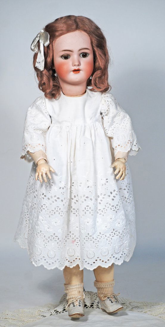 GERMAN BISQUE CHILD BY HANDWERCK: 91. GERMAN BISQUE CHILD BY HANDWERCK. 22”. Marks Heinrich Handwerck/Simon & Halbig. Bisque socket head, brown sleep eyes, painted and applied lashes, feathered brows, open mouth, upper teeth, or