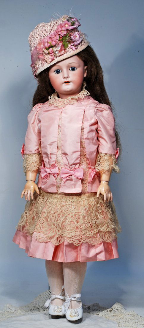 GERMAN BISQUE DOLL BY MYSTERY MAKER.: 92. GERMAN BISQUE DOLL BY MYSTERY MAKER. 25”. Marks: Germany 6 1/2. Bisque socket head, blue sleep eyes, painted lashes, feathered brows, open mouth upper teeth, brown human hair wig, compositio